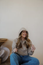 Load image into Gallery viewer, front view of model wearing the something more sweatshirt in the color taupe. model has the sweatshirt paired with the Hartford denim.