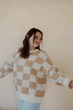 Load image into Gallery viewer, front view of model wearing the new beginnings sweater. model has the sweater paired with the Camden denim + an EBNS mini scrunchie scarf.
