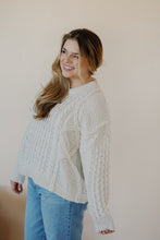 Load image into Gallery viewer, side view of model wearing the my way back home sweater in the color ivory. model has the sweater paired with the Hartford denim.