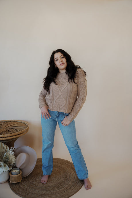 front view of model wearing the Hartford denim. model has the denim paired with the somewhere in the middle sweater in the color oat.