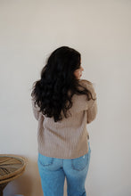 Load image into Gallery viewer, back view of model wearing the somewhere in the middle sweater in the color oat. model has the sweater paired with the Hartford denim.