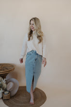 Load image into Gallery viewer, front view of model wearing the as long as I live denim midi skirt. model has the skirt paired with the halfway there top.