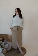 Load image into Gallery viewer, front view of model wearing the in another life skirt. model has the skirt paired with the every moment sweater in the color ivory.