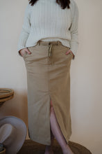 Load image into Gallery viewer, front view of model wearing the every moment sweater in the color ivory. model has the sweater paired with the in another life skirt.