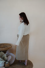Load image into Gallery viewer, back view of model wearing the every moment sweater in the color ivory. model has the sweater paired with the in another life skirt.