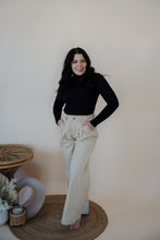 Load image into Gallery viewer, front view of model wearing the Oakland chinos. model has the chinos paired with the after all top in the color black.