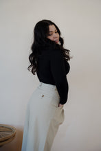 Load image into Gallery viewer, side view of model wearing the Oakland chinos. model has the chinos paired with the after all top in the color black.