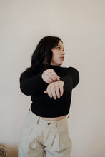 Load image into Gallery viewer, front view of model wearing the after all top in the color black. model has the top paired with the Oakland chinos.