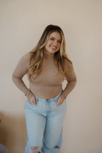 Load image into Gallery viewer, front view of model wearing the after all top in the color almond. model has the top paired with the Camden denim.
