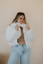 Load image into Gallery viewer, front view of model wearing the where it all began puffer in the color ivory. model has the puffer paired with the all along top in the color almond and the camden denim.