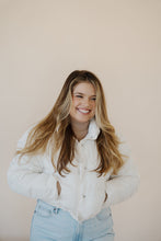 Load image into Gallery viewer, front view of model wearing the time after time puffer in the color ivory. model has the puffer paired with the all along top in the color almond and the camden denim.