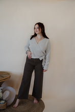 Load image into Gallery viewer, front view of model wearing the Addison denim in the color brown. model has the denim paired with the when you were mine sweater in the color oatmeal.