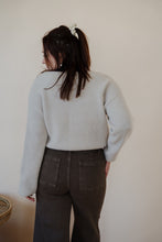 Load image into Gallery viewer, back view of model wearing the Addison denim in the color brown. model has the denim paired with the when you were mine sweater in the color oatmeal.