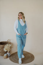Load image into Gallery viewer, front view of model wearing the clara denim jumpsuit in denim.