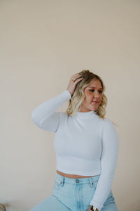 front view of model wearing the after all top in the color white. model has the top paired with the camden denim.