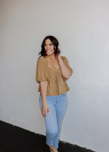 Load image into Gallery viewer, model wearing the everything I need top. model has the top paired with a pair of light wash denim.