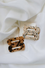 Load image into Gallery viewer, ophelia barrettes in the colors tortoise and marble. barrettes are shown attached to an accessory card laid on top of a white sheet.