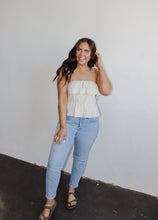 Load image into Gallery viewer, model wearing the by the shore top. model has the top paired with a pair of lightwash denim and neutral flatbed sandals.