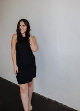 Load image into Gallery viewer, model wearing the keeping score dress in the color black.