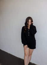 Load image into Gallery viewer, model wearing the before you go knit sweater romper in the color black.