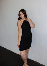 Load image into Gallery viewer, model wearing the keeping score dress in the color black.