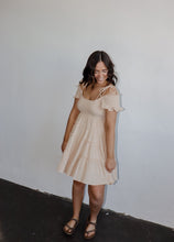 Load image into Gallery viewer, model wearing the drift away mini dress. model has the dress paired with a neutral pair of flatbed sandals.