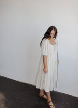 Load image into Gallery viewer, model wearing the low tide maxi dress. model has the dress paired with a pair of neutral flatbed sandals.