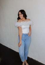 Load image into Gallery viewer, model wearing the crazy in love bodysuit in the color white. model has the top paired with a pair of light wash denim.