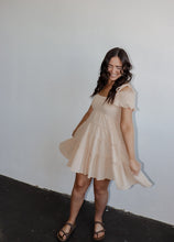 Load image into Gallery viewer, model wearing the drift away mini dress. model has the dress paired with a neutral pair of flatbed sandals.