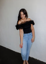 Load image into Gallery viewer, model wearing the crazy in love bodysuit in the color black. model has the top paired with a pair of light wash denim.