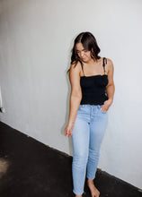 Load image into Gallery viewer, model wearing the so surreal top. model has the top paired with a pair of light wash denim.