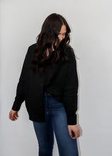 Load image into Gallery viewer, model wearing the play by my rules top in the color black. model has the top paired with a pair of high-waited, dark-wash denim.