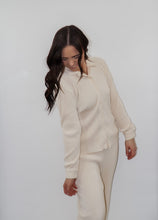 Load image into Gallery viewer, model wearing the aspen top + aspen pants in the color cream.