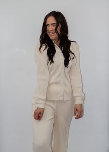 model wearing the aspen top + aspen pants in the color cream.