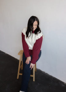 model wearing the all my days sweater vest paired with the take me away top in the color merlot. model has the tops paired with the siena denim.
