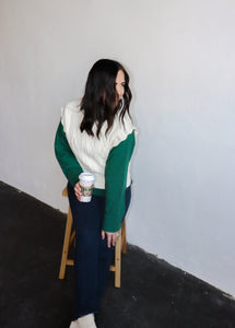 model wearing the all my days sweater vest paired with the take me away top in the color deep green. model has the tops paired with the siena denim.