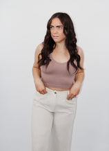 Load image into Gallery viewer, model wearing the stay the same top in the color espresso. model has the top paired with the chelsea linen trousers in the color oatmeal.