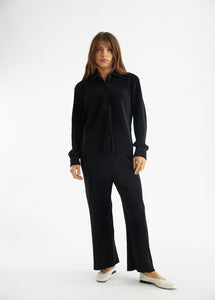model wearing the aspen top + aspen pants in the color black.