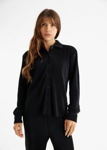 model wearing the aspen top + aspen pants in the color black.